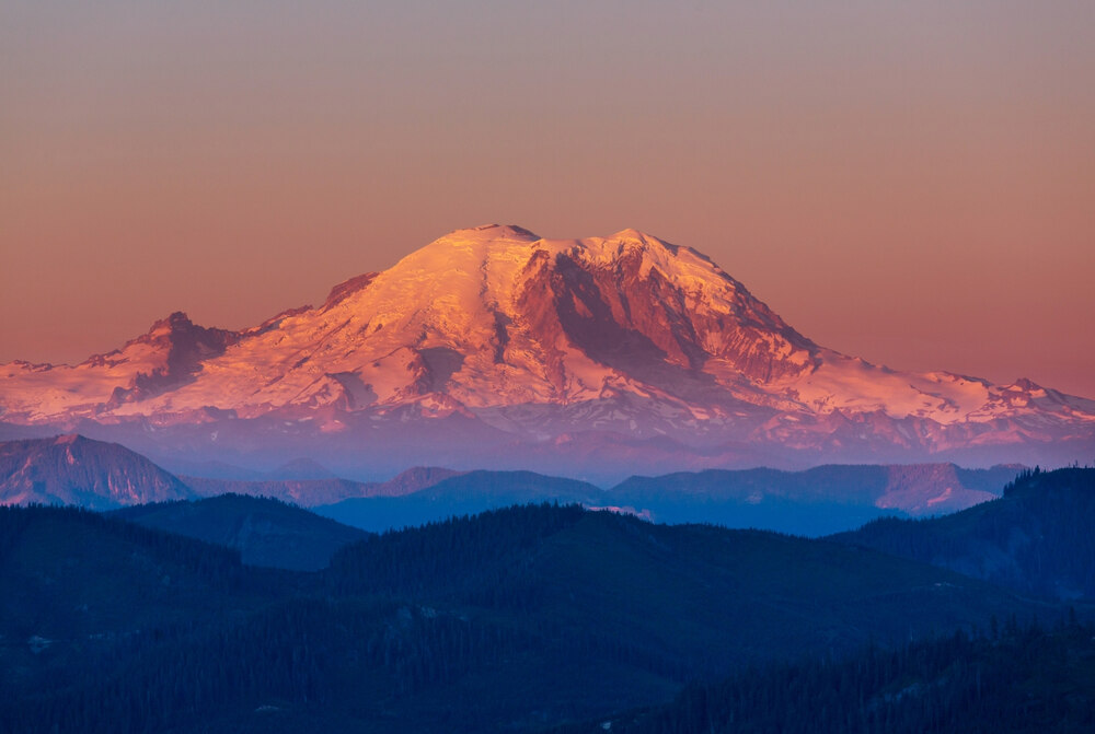 beautiful sunset over Mount Rainier National Park and the surrounding mountains and valleys