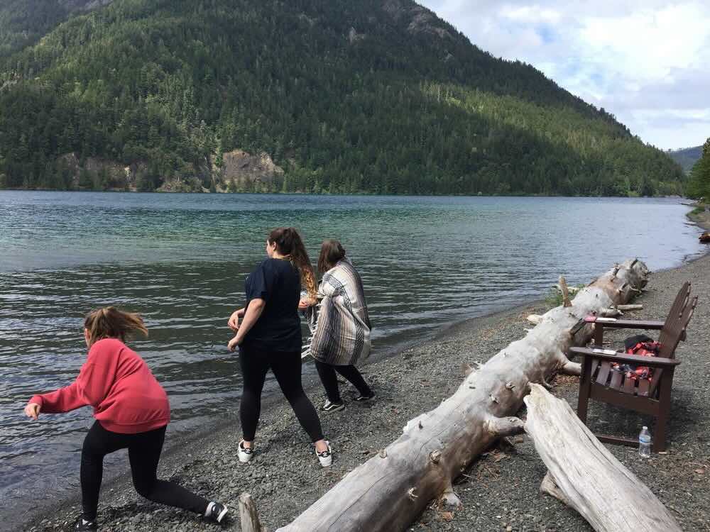 people enjoying lake crescent at olympic national park
