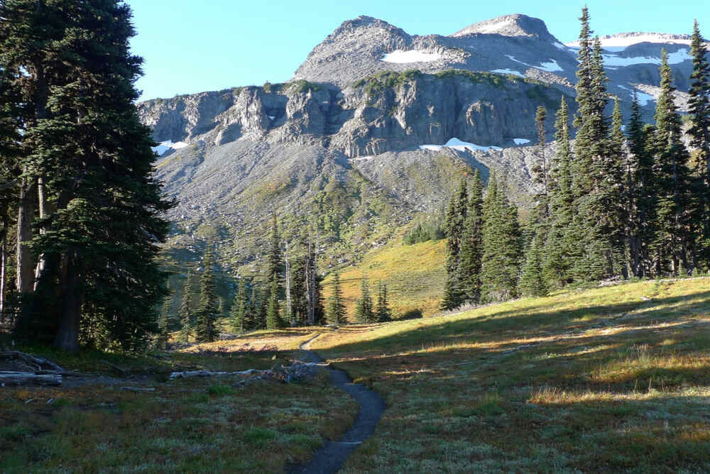 Summerland backcountry camping in Mount Rainier National Park showing access to the Wonderland Trail and beautiful wildflower displays in late summer