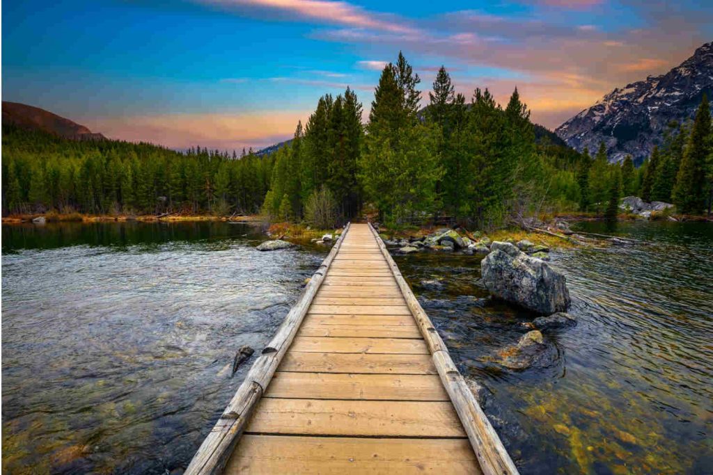a bridge crosses over Taggart Lake along the Taggart Lake Trail in GTNP