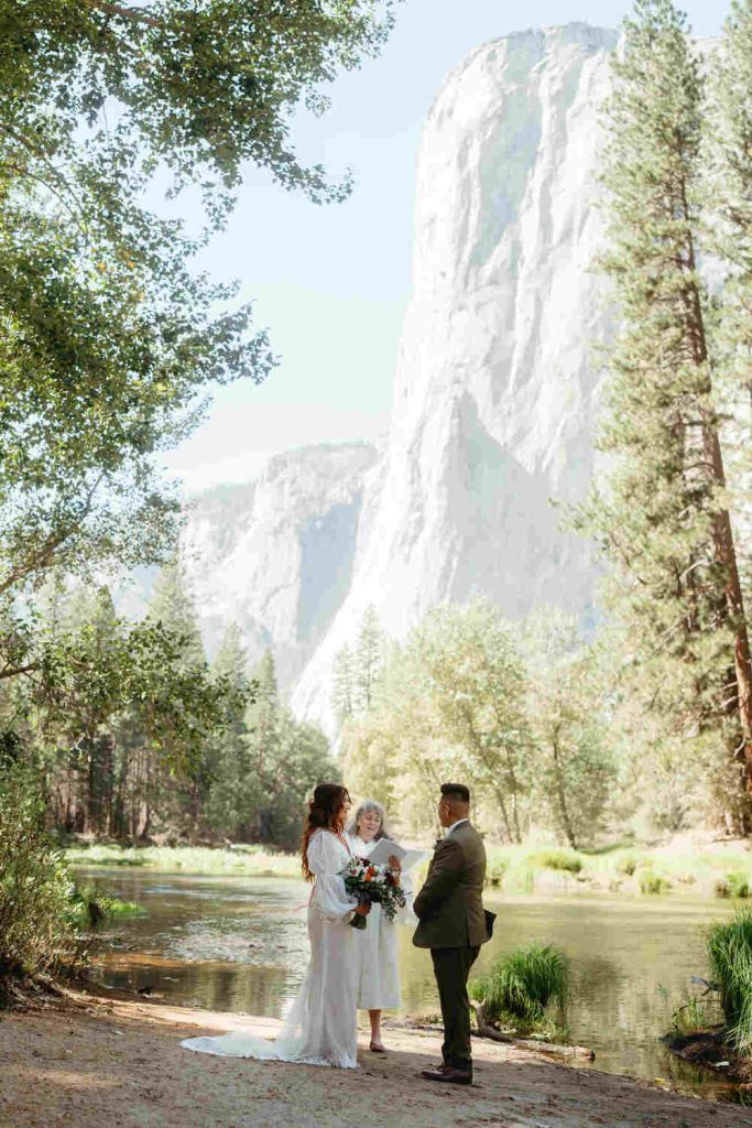 wedding ceremony inside Yosemite National Park with bride and groom taking their vows