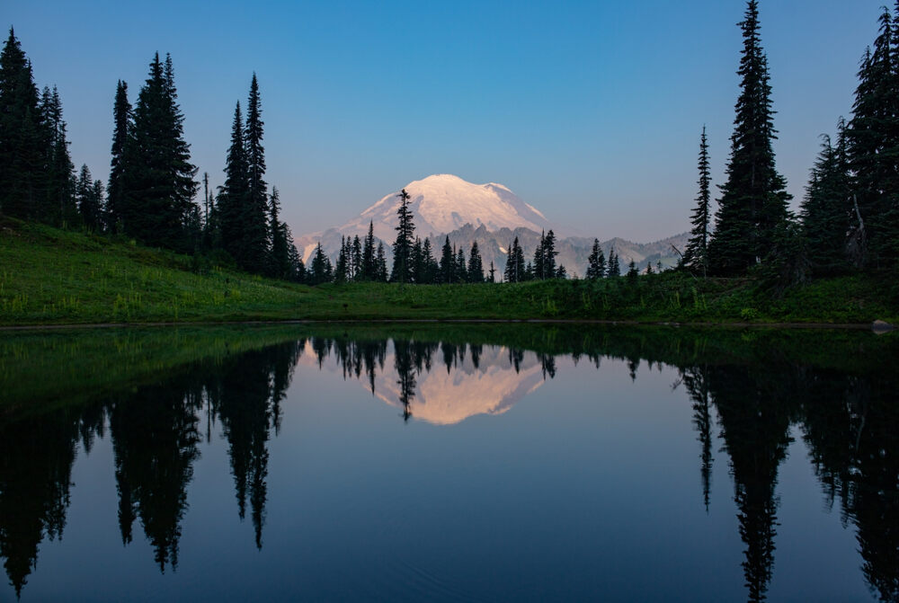 Mount Rainier reflects against the calm surface of Tipsoo Lake