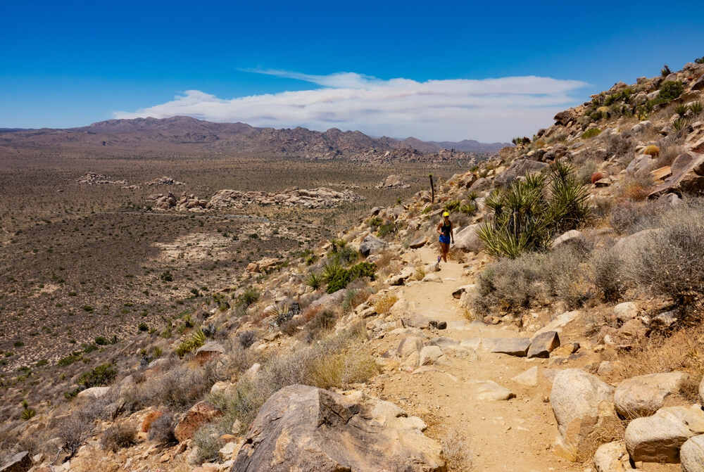 A hiker makes their way up to the summit of Ryan Mountain inside Joshua Tree National Park