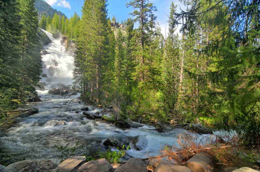 rushing water down hidden falls in grand teton np